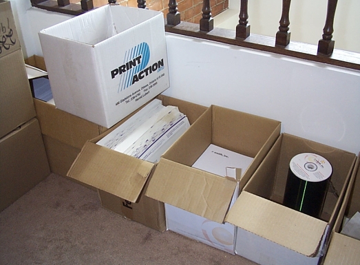 e-smith 'warehouse': a pile of boxes with stationery and Federal Express envelopes